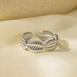 Silver stainless steel open ring with shell texture on silk background