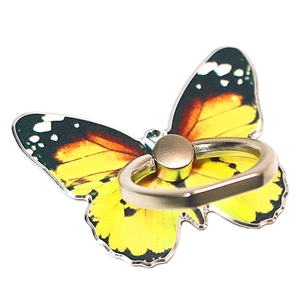 Detail of butterfly phone ring holder with yellow gradient wings and metal swivel ring
