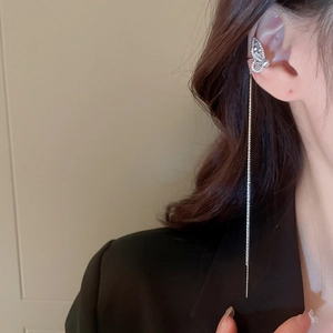 Elegant silver butterfly ear cuff with sparkling rhinestones, pearl, and long tassel chain