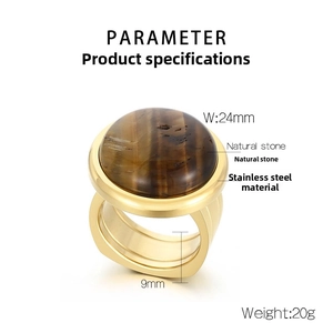 Macro shot of 24mm round natural tiger eye stone set on a 9mm wide gold stainless steel ring