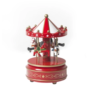 Red carousel wooden music box with golden stars and four horses on a white background
