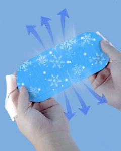 Close-up of disposable blue cooling eye mask with snowflake patterns for tired eyes