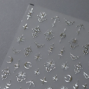3D embossed silver nail stickers with celestial stars and moon patterns on clear film