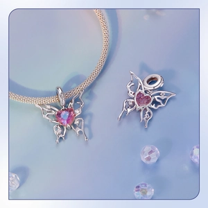 Detail of s925 silver hollow butterfly charm with pink heart stone and white zircon