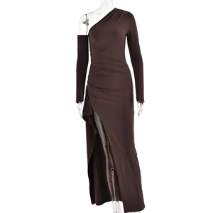 Detail view of deep brown ruched dress with side slit and slanted shoulder design