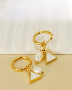 Detail view of 18K gold plated earrings with natural pearls and eco-friendly steel