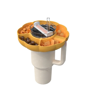 Yellow petal-shaped silicone snack bowl for 40oz tumbler with built-in phone holder