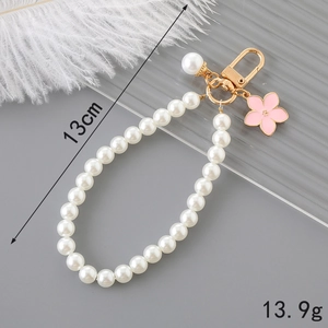Elegant pearl bead keychain with pink flower charm and gold lobster clasp for bags