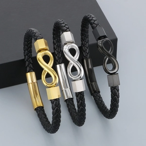Detailed view of infinity charm braided leather bracelets in gold, silver, and gunmetal finishes