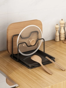 Detail of matte black metal kitchen rack with two slots and a removable drip tray base