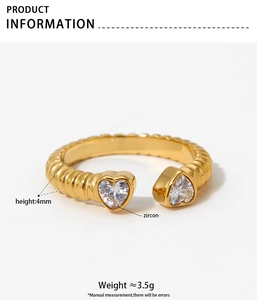 Detail view of heart zircon open ring with textured gold band and 4mm height specs
