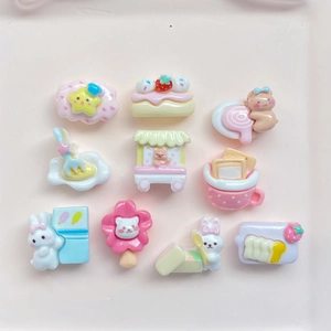 Flat lay of colorful resin bear and food miniatures for DIY charms and nail art