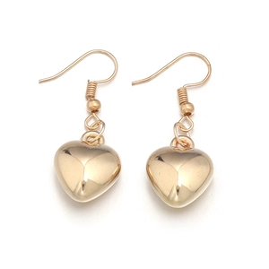 Polished gold heart drop earrings in a minimalist metal design on white background