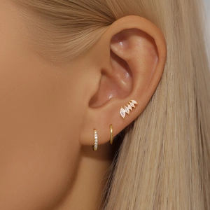 Elegant gold S925 silver marquise zircon stud earrings set for women displayed on ear