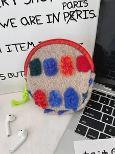 Vintage round plush makeup bag with colorful patches and green zipper tassel