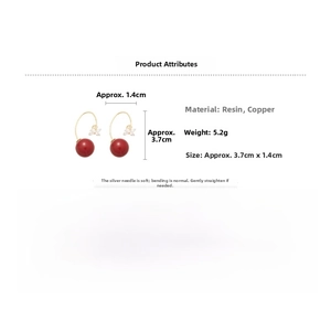 Detail view showing red resin beads, gold plating, and dimensions of luxury earrings