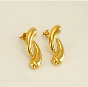 Close-up of 18k gold plated stainless steel stud earrings with abstract geometric curves