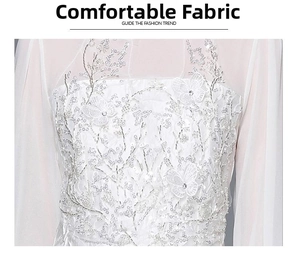 Detail of white mesh dress with intricate butterfly embroidery and silver sequins