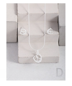Detail view of S925 silver pretzel heart necklace and matching earrings set