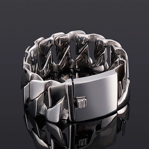 Macro shot of industrial style stainless steel chunky D-shaped curb chain bracelet