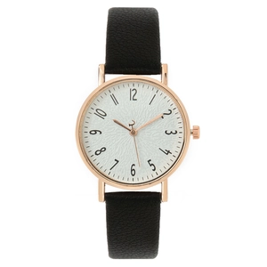 Rose gold quartz watch with white textured dial, black numerals and black leather strap