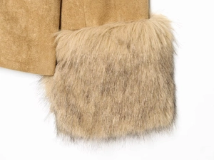 Detail of brown faux suede fabric with plush faux fur trim on a stylish autumn coat