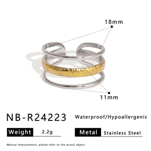 Detailed view of 11mm wide triple-layered gold and silver stainless steel open ring