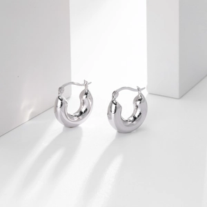 Detailed close-up showing the 925 silver hallmark on polished hoop earrings