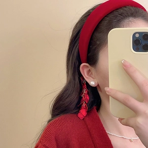 Ethnic velvet headband styled with matching red petal earrings and pearl necklace