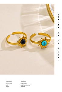 Detail of adjustable gold sunburst rings featuring turquoise and black obsidian stone inlay