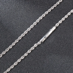Macro shot of silver stainless steel twisted rope chain with cylindrical clasp detail
