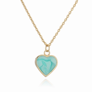 Golden heart pendant necklace with turquoise marble inlay on a white background