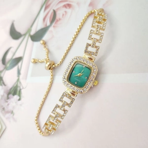 Elegant square green face gold watch with diamond accents and adjustable bracelet strap