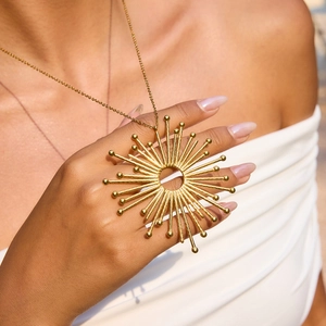 18K gold plated stainless steel sunburst hollow pendant necklace on a model