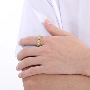 Close-up of a men's gold plated cuban link ring with paved cubic zirconia stones