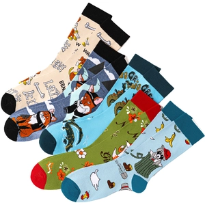 Detailed view of five pairs of colorful knitted cotton socks with unique animal prints