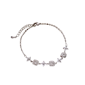 Adjustable 18K gold plated square and flower charm bracelet with sparkling zircons