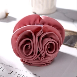Elegant dusty rose satin fabric hair claw clip featuring a 3D layered rose flower design