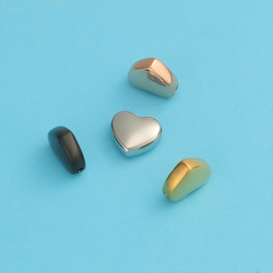 Polished stainless steel heart-shaped charms in silver, gold, rose gold, and black colors