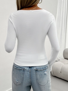 Rear view of white ribbed long sleeve top showing slim fit design and quality fabric