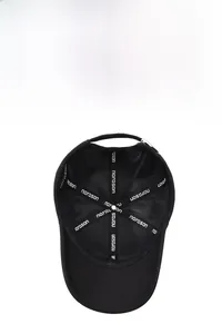 Detail view of the breathable mesh lining and reinforced inner seams of the black baseball cap