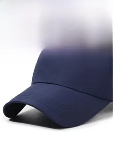 Close-up of navy blue baseball cap brim with durable reinforced stitching and stiff texture