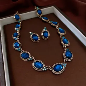 Parure collier et boucles d'oreilles vintage avec pierres ovales bleu foncé et or