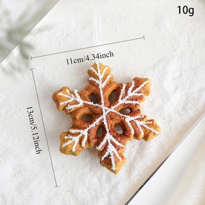 Macro detail of gingerbread snowflake ornament with dimensions 13cm by 11cm