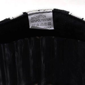 Vintage plaid newsboy cap details showing 35% cotton 65% polyester fabric label