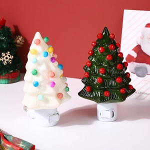 Detail of Christmas tree night lights in white and green with ON/OFF switch plug
