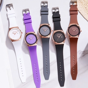 Set of five Modaiya minimalist quartz watches with colorful silicone straps on marble background
