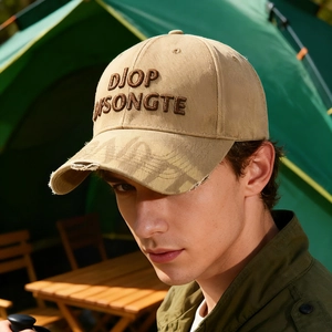 Distressed khaki baseball cap with 3D embroidery and wide brim in outdoor camping scene