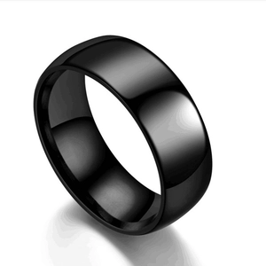 Macro shot of minimalist black titanium steel band ring with polished glossy finish