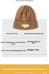 Detail view of khaki knit beanie with cashmere texture and specific size dimensions